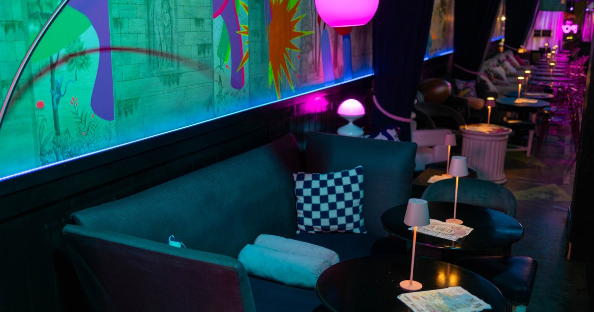 Interior, lounge area, two seater sofa with two coffee tables