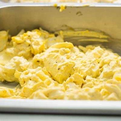 Egg salad in a metal tray.