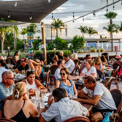 Customers eating and drinking outdoors.