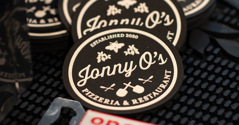 Glass coasters with the company logo