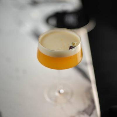 Mango chutney martini on a marble table.