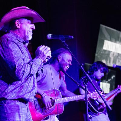 Musicians performing on stage.