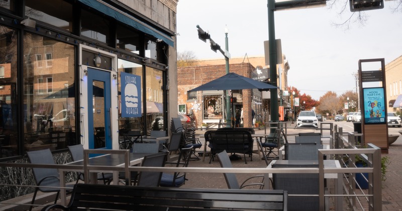 Outdoor seating area in front of the restaurant entrance