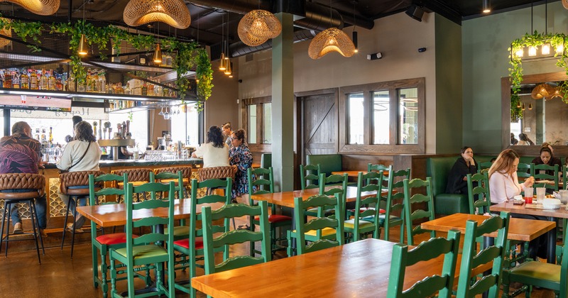Interior seating area and bar with guests