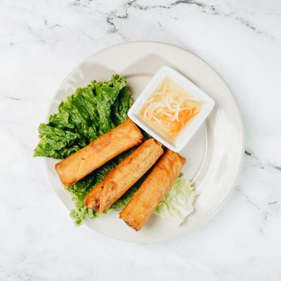 Vietnamese egg rolls served with a homemade sauce.