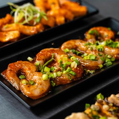 Korean BBQ shrimp finished with fresh scallions.
