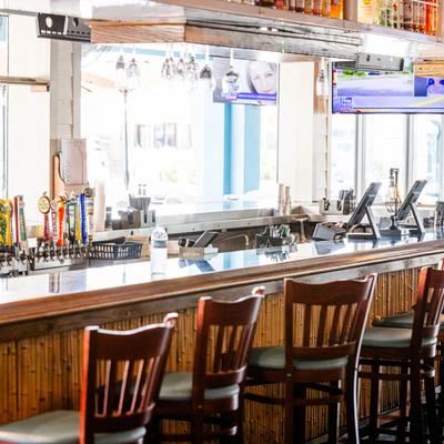 The bar counter and stools.