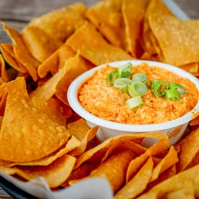 Buffalo chicken dip served with tortilla chips.