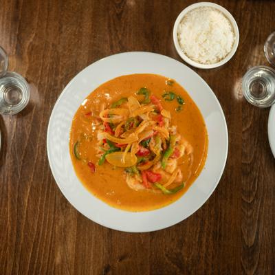 Thai curry shrimp served with white rice on the side.