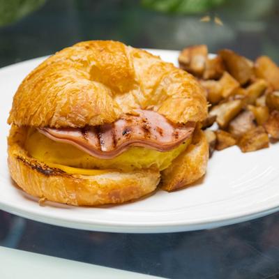 Sandwich with ham, egg, cheese, avocado.