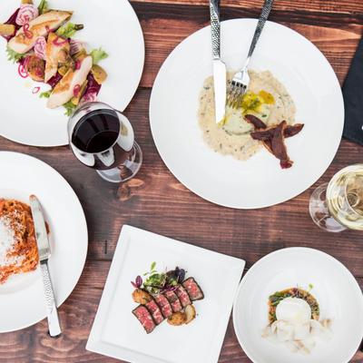 Various food and a glass of red wine.