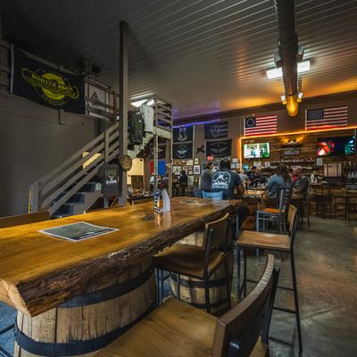 Seating area, carved wooden tables.