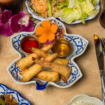 Stuffed shrimp rolls served with plum sauce.