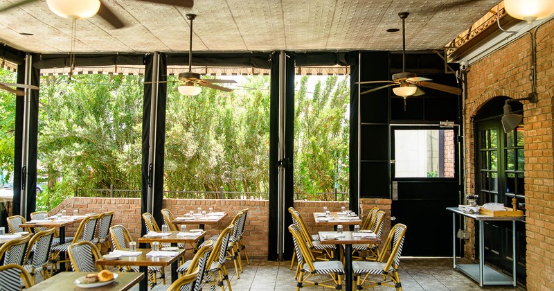 Interior, dining area with tables and yellow chairs