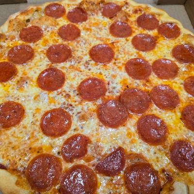 Large pepperoni pizza with melted cheese.