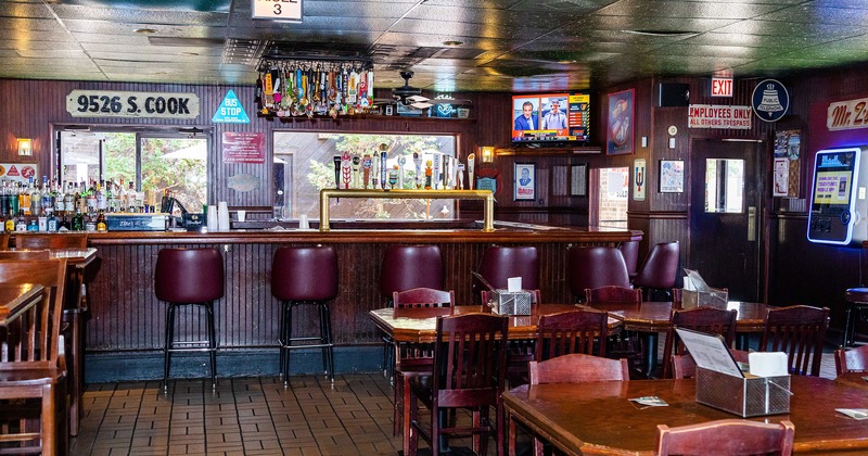 Interior, bar area with dining tables