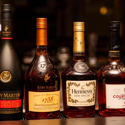 Several bottles of Cognac on the bar counter.