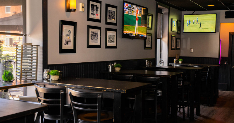 Interior - a lot of pictures on the walls, wooden tables and chairs