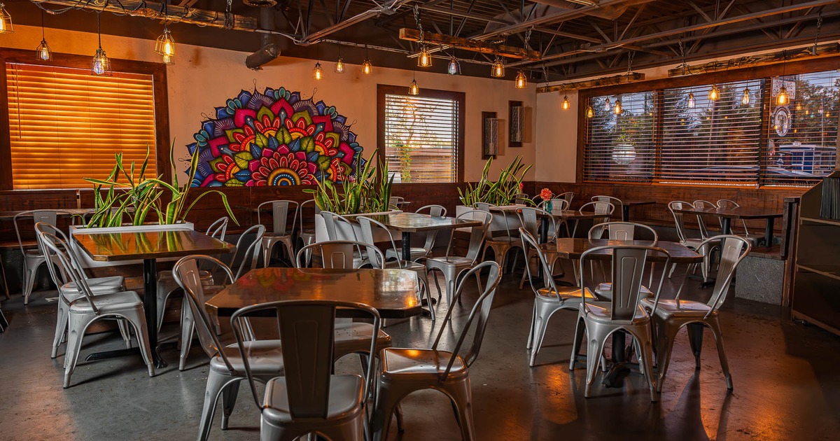 Main dining area with seating and decoration on the wall