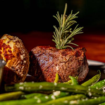 Filet Mignon, with green beans, baked potato, and rosemary.