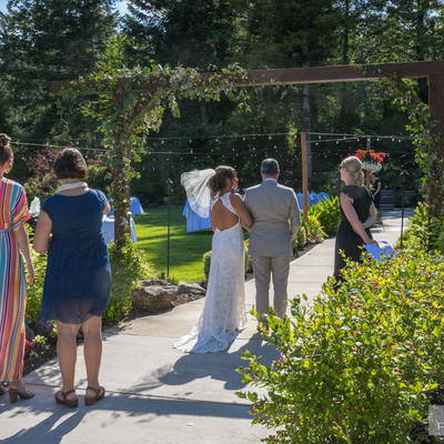 Groom and bride walking towards the restaurant closeup