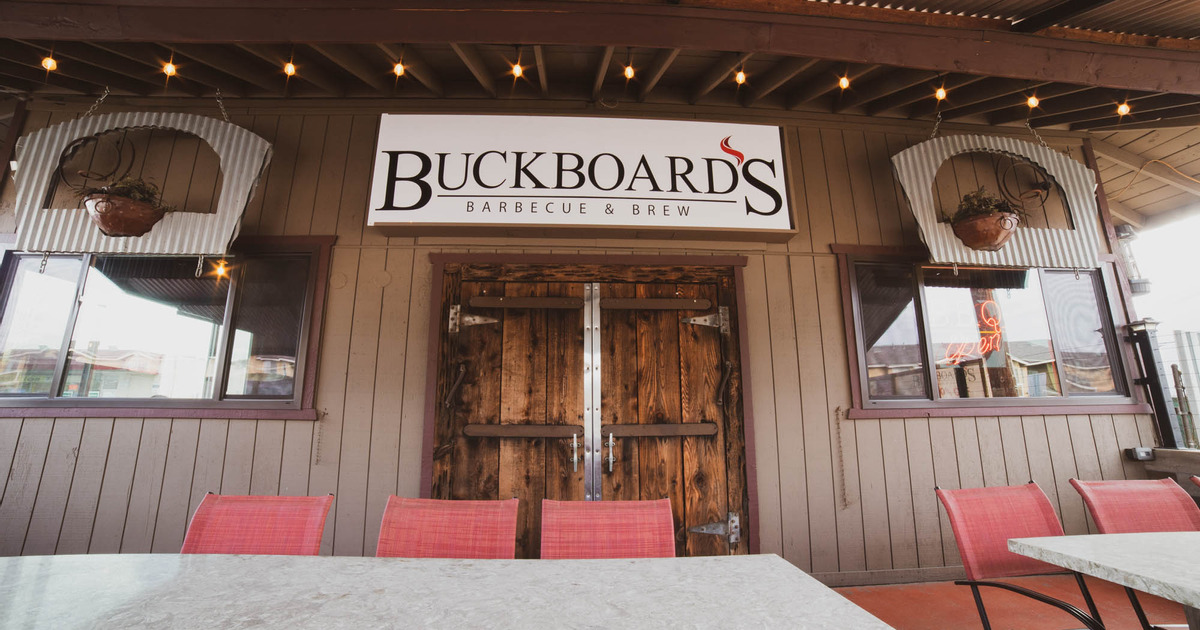 Exterior, patio tables, wooden doors in the back