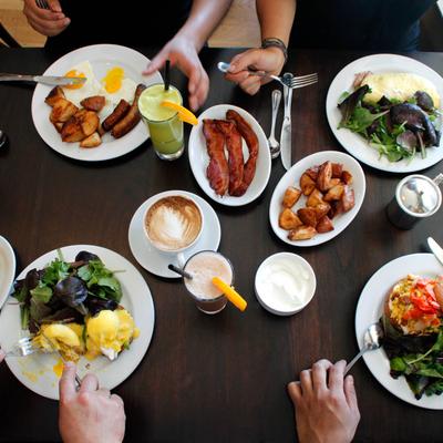 A variety of breakfast dishes and drinks on the table.