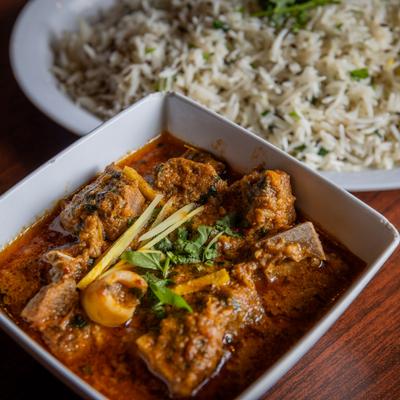 Goat curry and a side of rice.