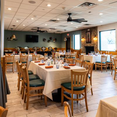 Dining area with tables and chairs.