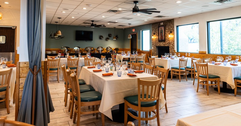Interior, spacious dining area with tables and chairs