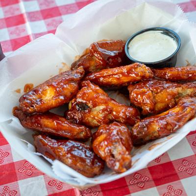 BBQ chicken wings with ranch sauce.