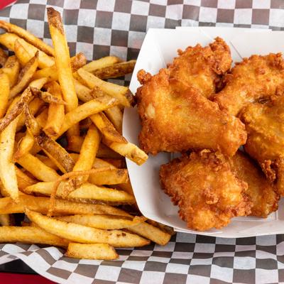 Breaded chicken wings and fries.