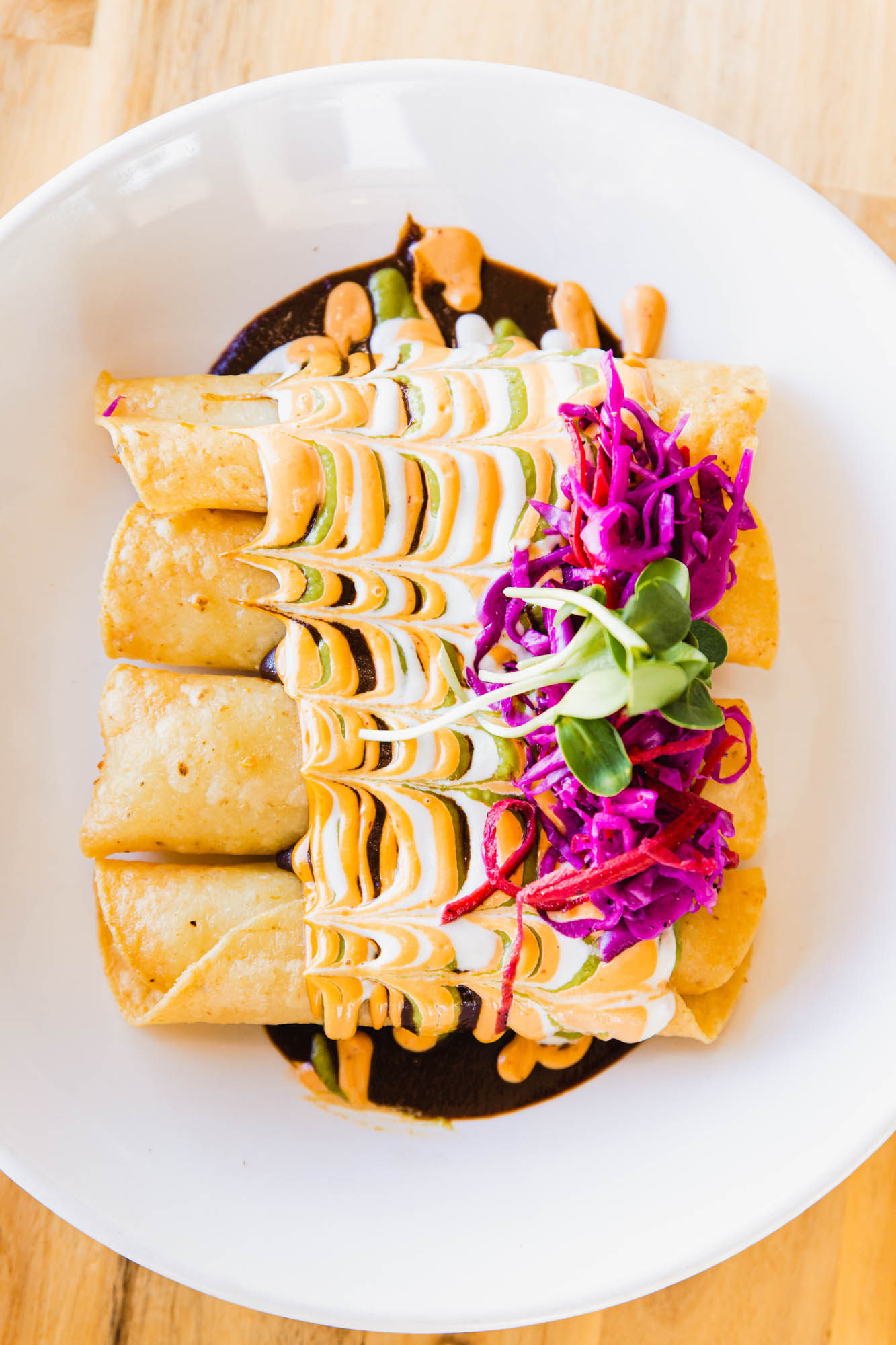 Quinoa, greens, cherry tomatoes, sweet potatoes and pickled beets, bowl