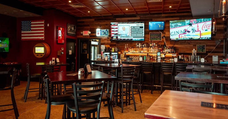 Interior, bar area with seating area and big tv's