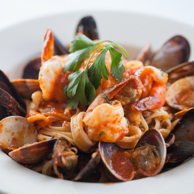 Spaghetti with clams, mussels, shrimp, scallops, calamari, garlic and tomato sauce.