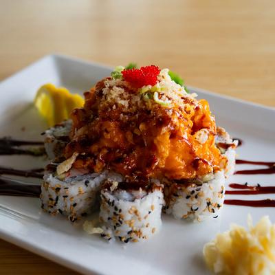 California rolls, topped with shrimp and crab mix, spicy sauce, scallions, and red roe.
