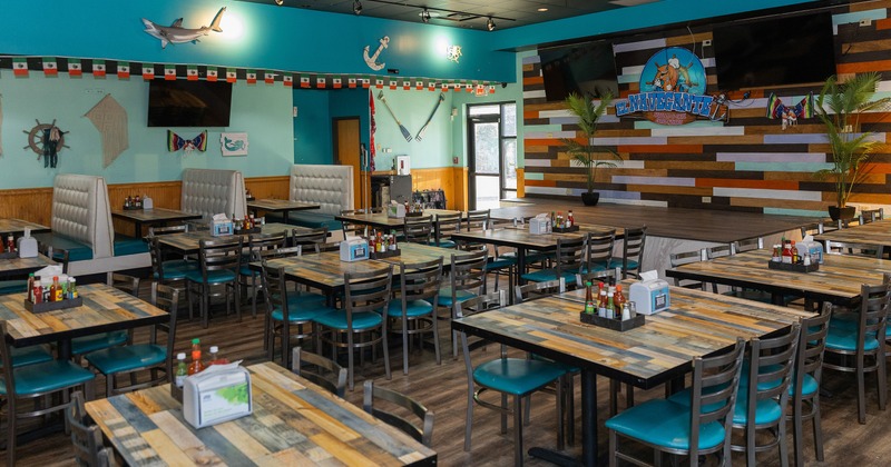 Spacious, cozy and nicely done interior dining area with dining tables ready for guests