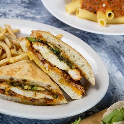 Southwest Chicken Sandwich plate on a table with various dishes.