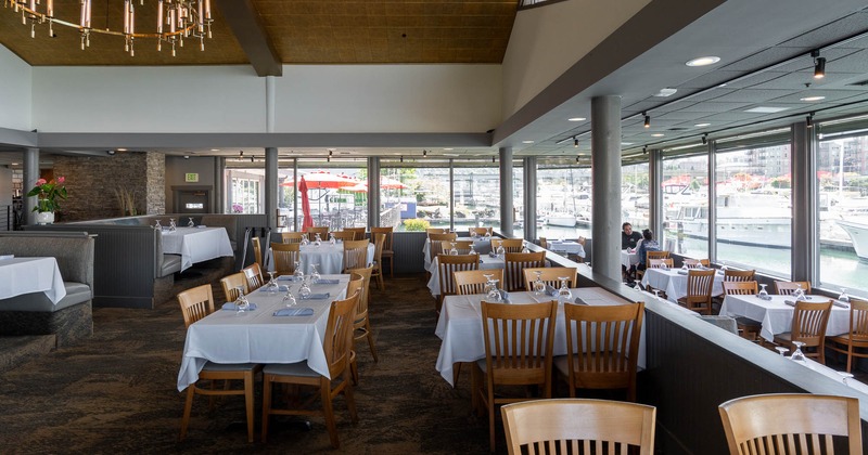 The dining area features wooden tables and chairs
