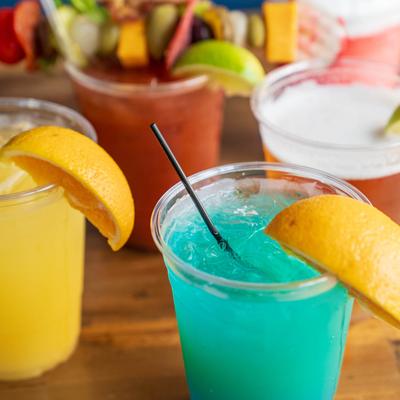 Assorted cocktails displayed on a table, close up.