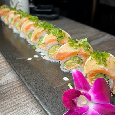 Sushi rolls with spicy crab, avocado, cucumber, salmon, lemon, jalapenos, cilantro, and ponzu.