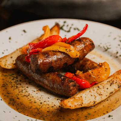 Italian sausage and peppers vesuvio, closeup.