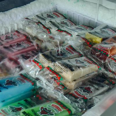 Freezer chest filled with popsicles.