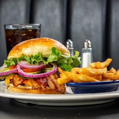 Bison burger, served with fries and a soda.