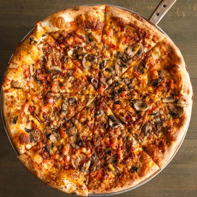 Cheeseburger pizza, served.