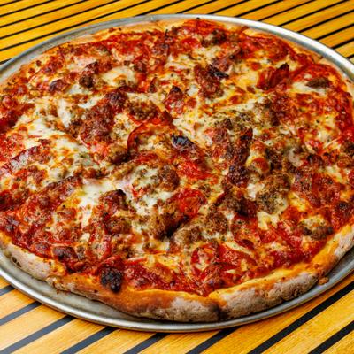 Hand Tossed All Meat Pizza served on the table.