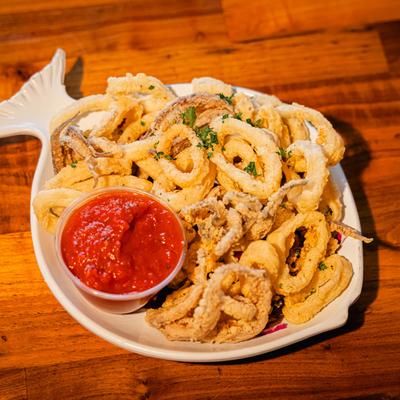 Fried calamari, served, top view.