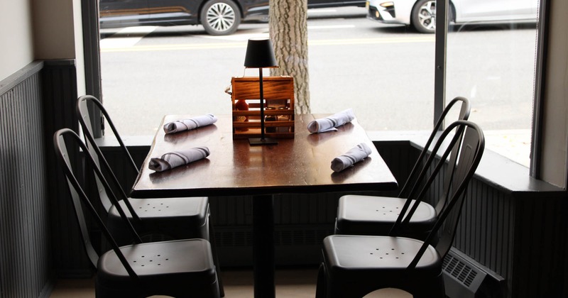 Dining table in the corner by the large window