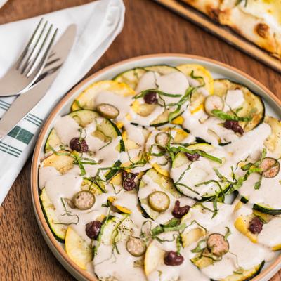 Grilled zucchini pizza with tuna and anchovy sauce.