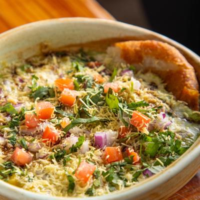 Fried potato cakes, with vegetables and noodles.